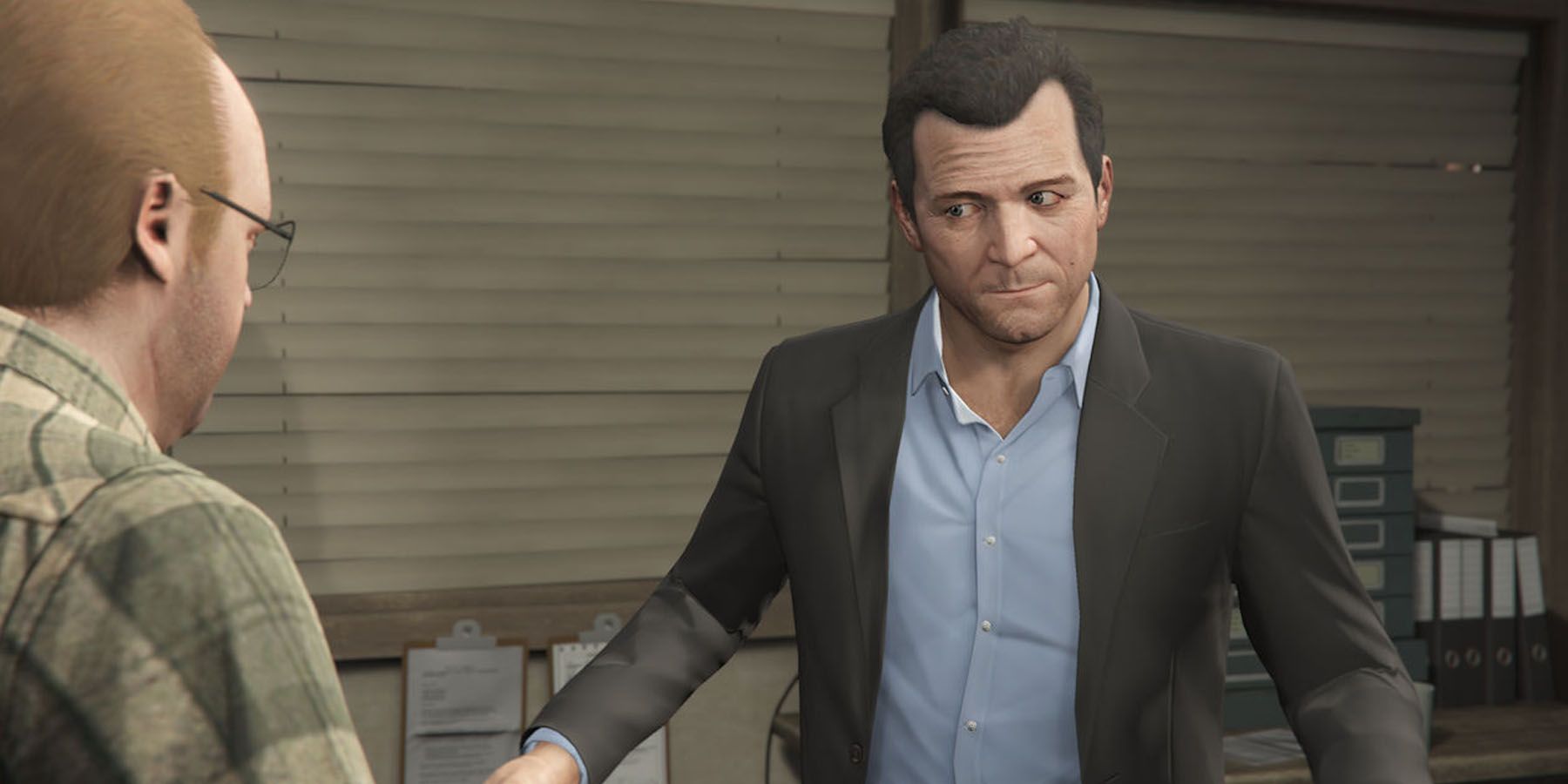 A screenshot of Michael planning a heist with Lester in Grand Theft Auto 5.