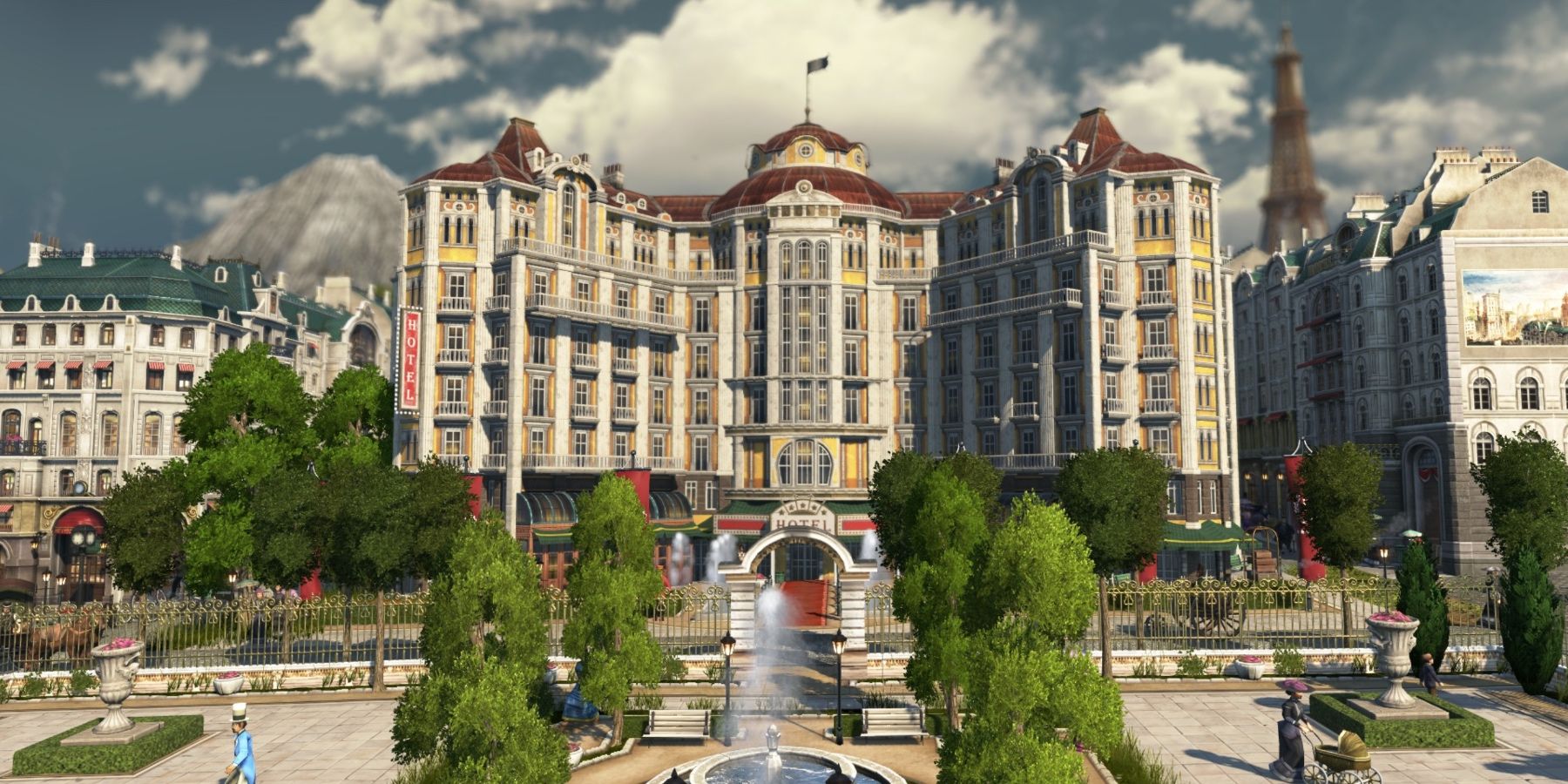 A city building which is very beautiful, with trees and fountains in the street outside