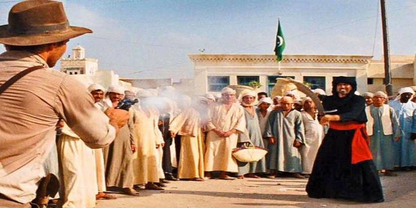 Indiana Jones shoots a man armed with a scimitar