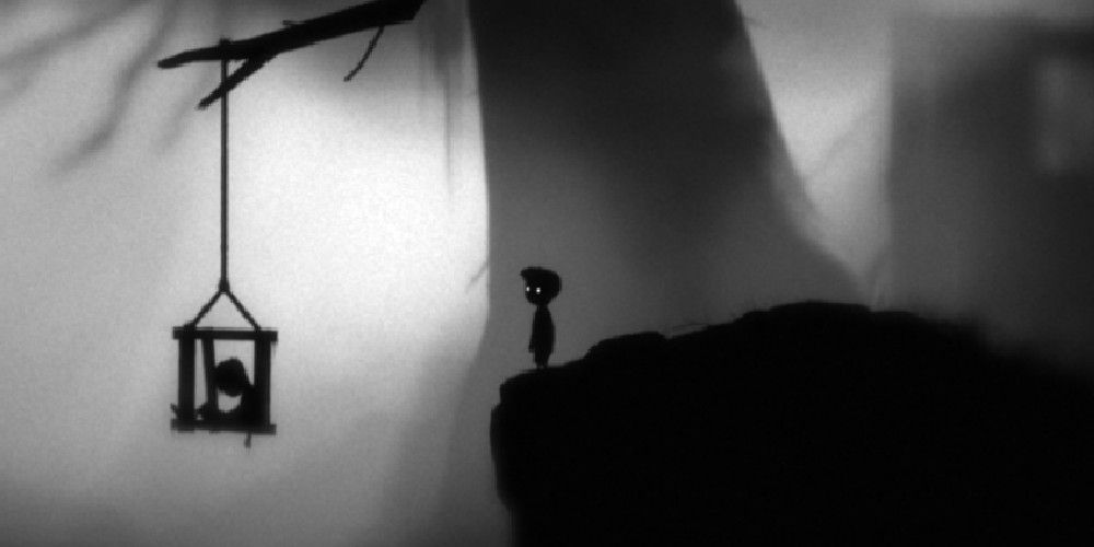 The protagnist of Limbo looking at a dead child in a cage hanging from a tree branch.