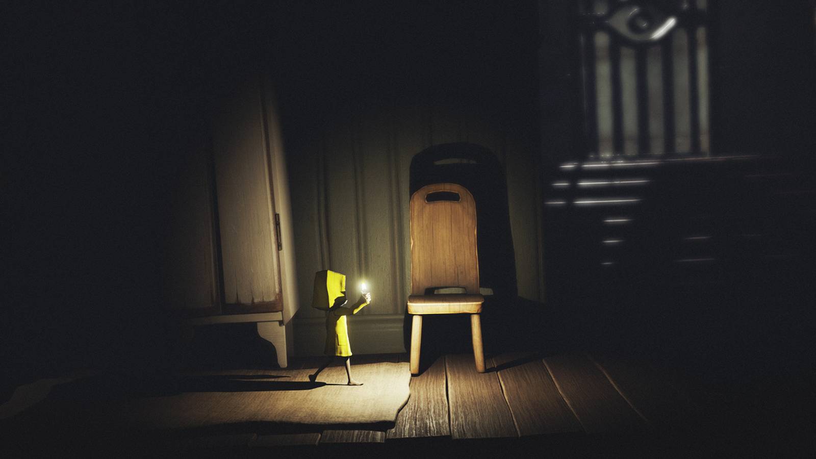 Little nightmares Mono holding a candle in a dark room
