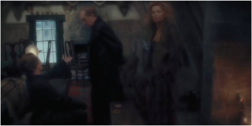 Harry beneath the Invisibility Cloak at three broomsticks in Harry Potter and the Prisoner of Azkaban.