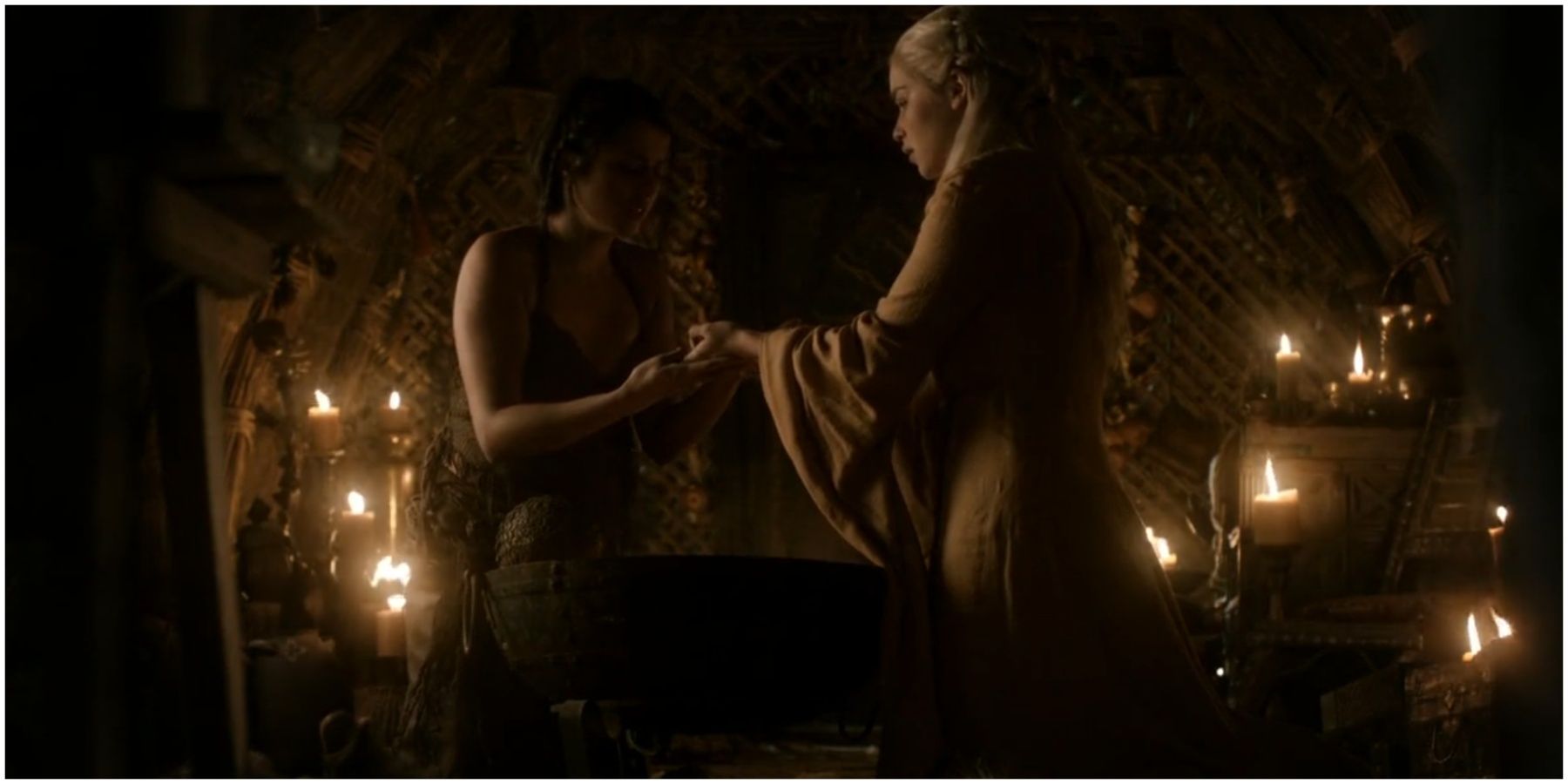 Irri examines Daenerys Targaryen's hands in Game of Thrones.