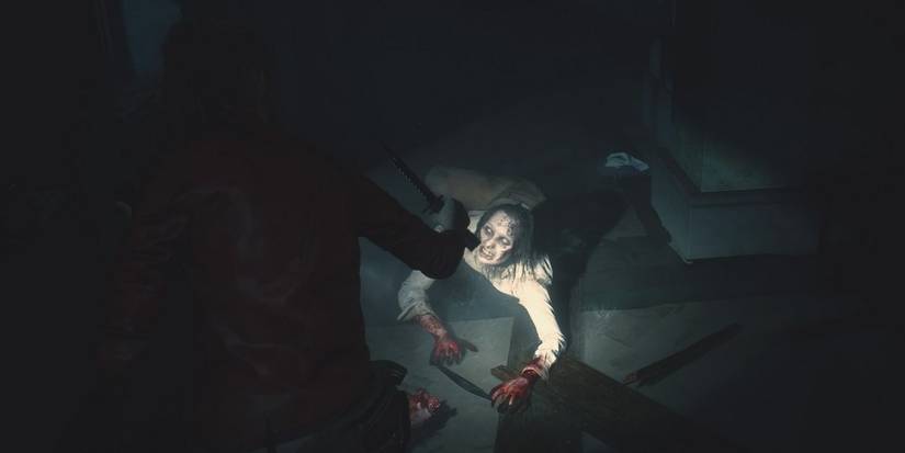 claire getting ready to knife a zombie