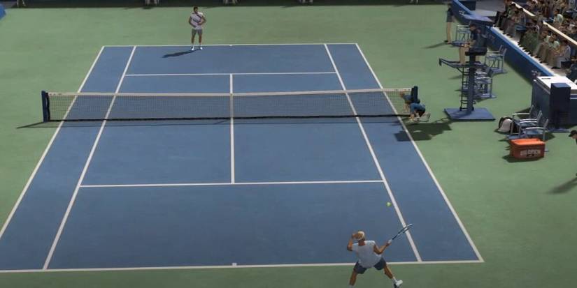 Two players rallying a ball on a. tennis court 