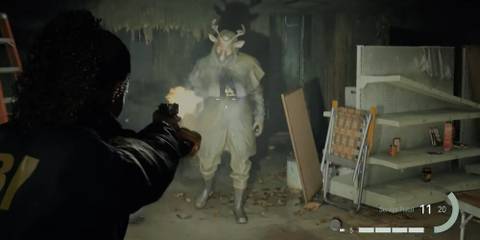 Alan Wake 2 - Saga firing at an enemy with a deer head 
