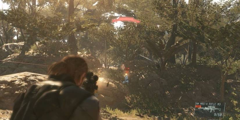 Snake firing an assault rifle at an enemy in the jungle 