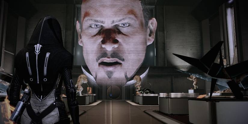 Kasumi talking to a projection of Hock 