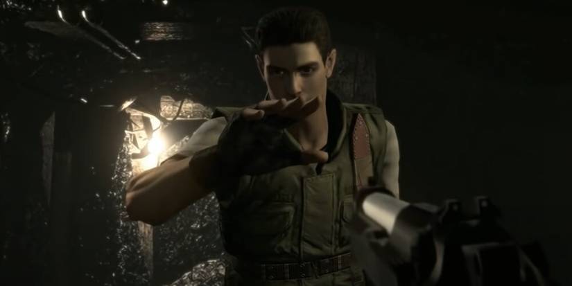 A handgun being aimed at Chris 