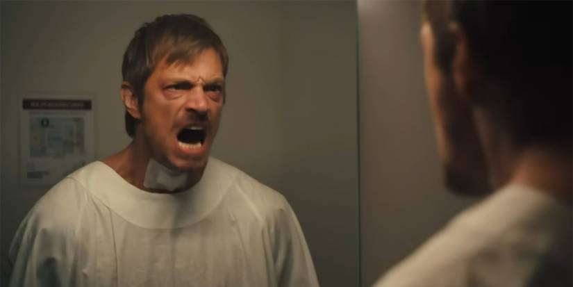 Brian (Joel Kinnamon) yelling in the mirror in Silent Night