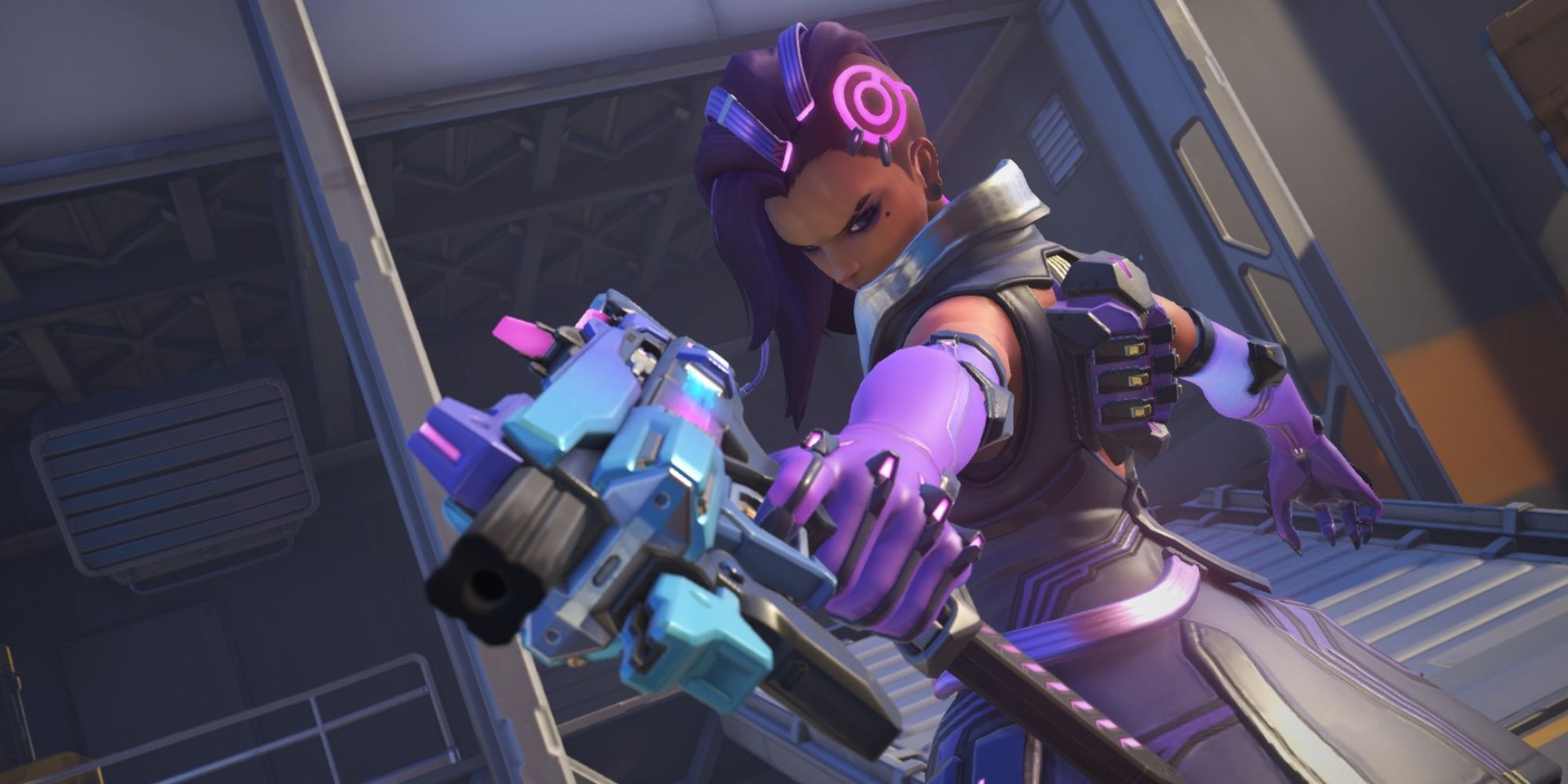 Sombra from Overwatch 2 points her gun at the camera