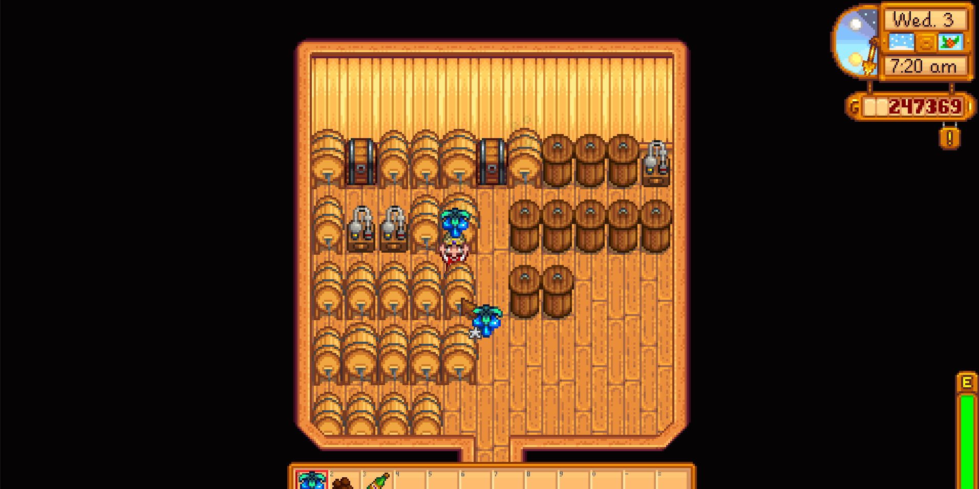 Image of a character placing a Crystal Fruit into a keg in Stardew Valley