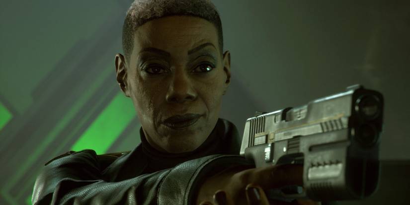 A screenshot of Amanda Waller aiming a gun against a green background in Suicide Squad: Kill the Justice League.