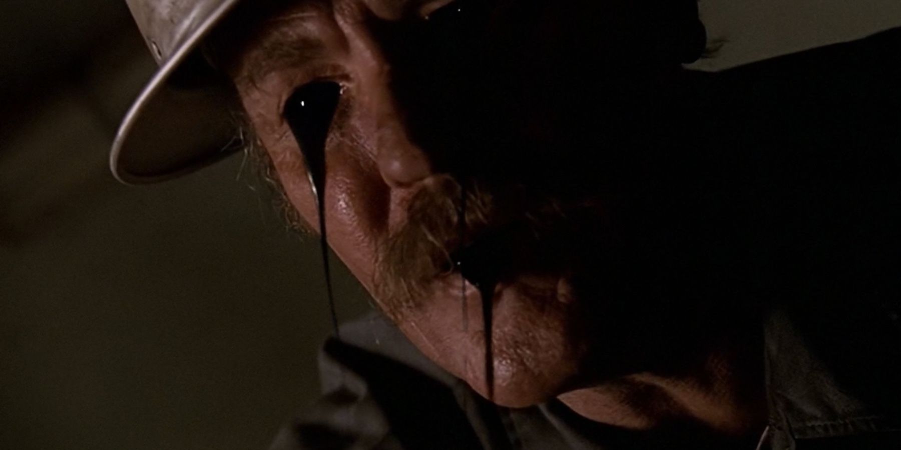 A man with black oil coming out of his face in The X-Files