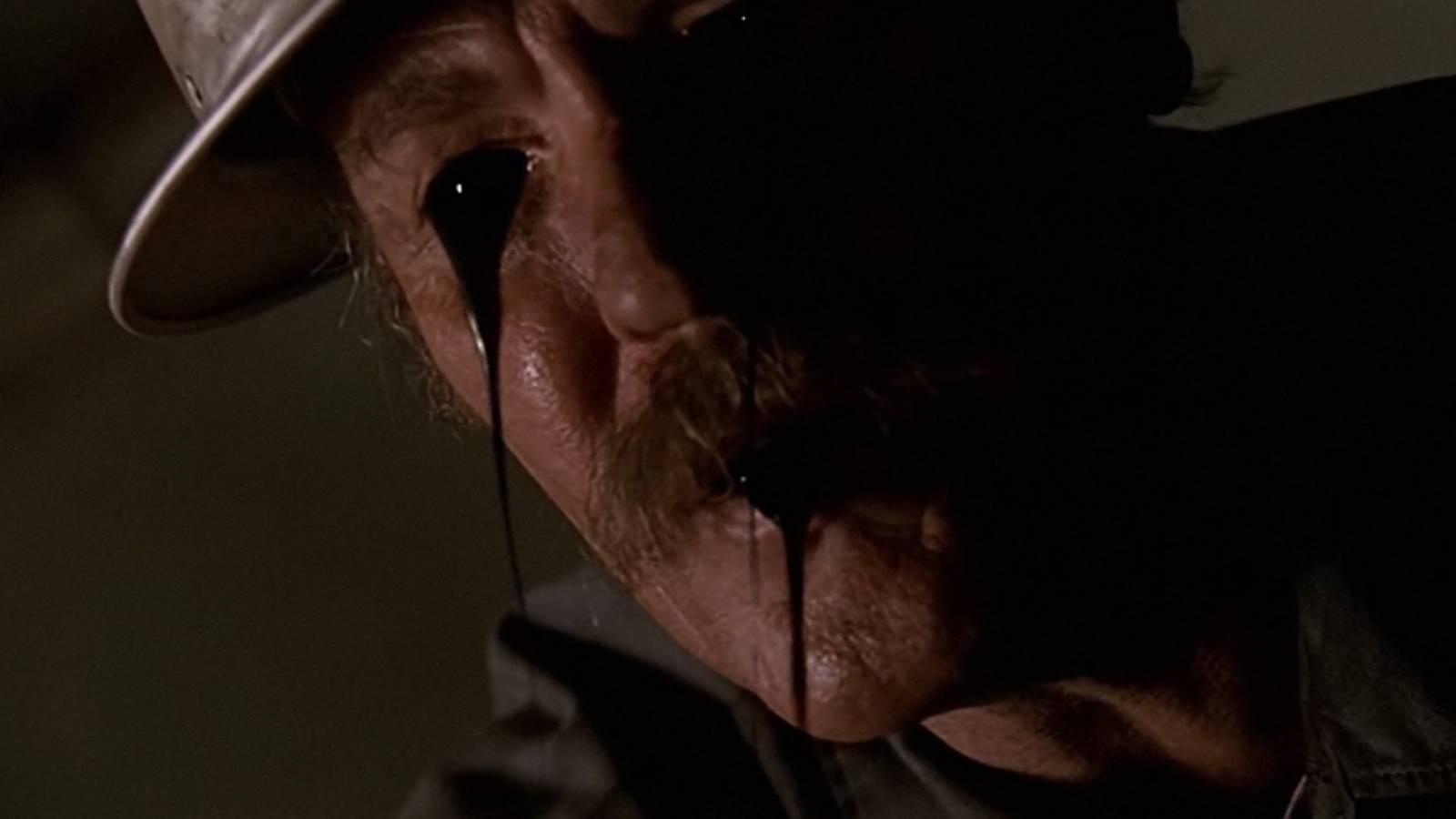 A man with black oil coming out of his face in The X-Files