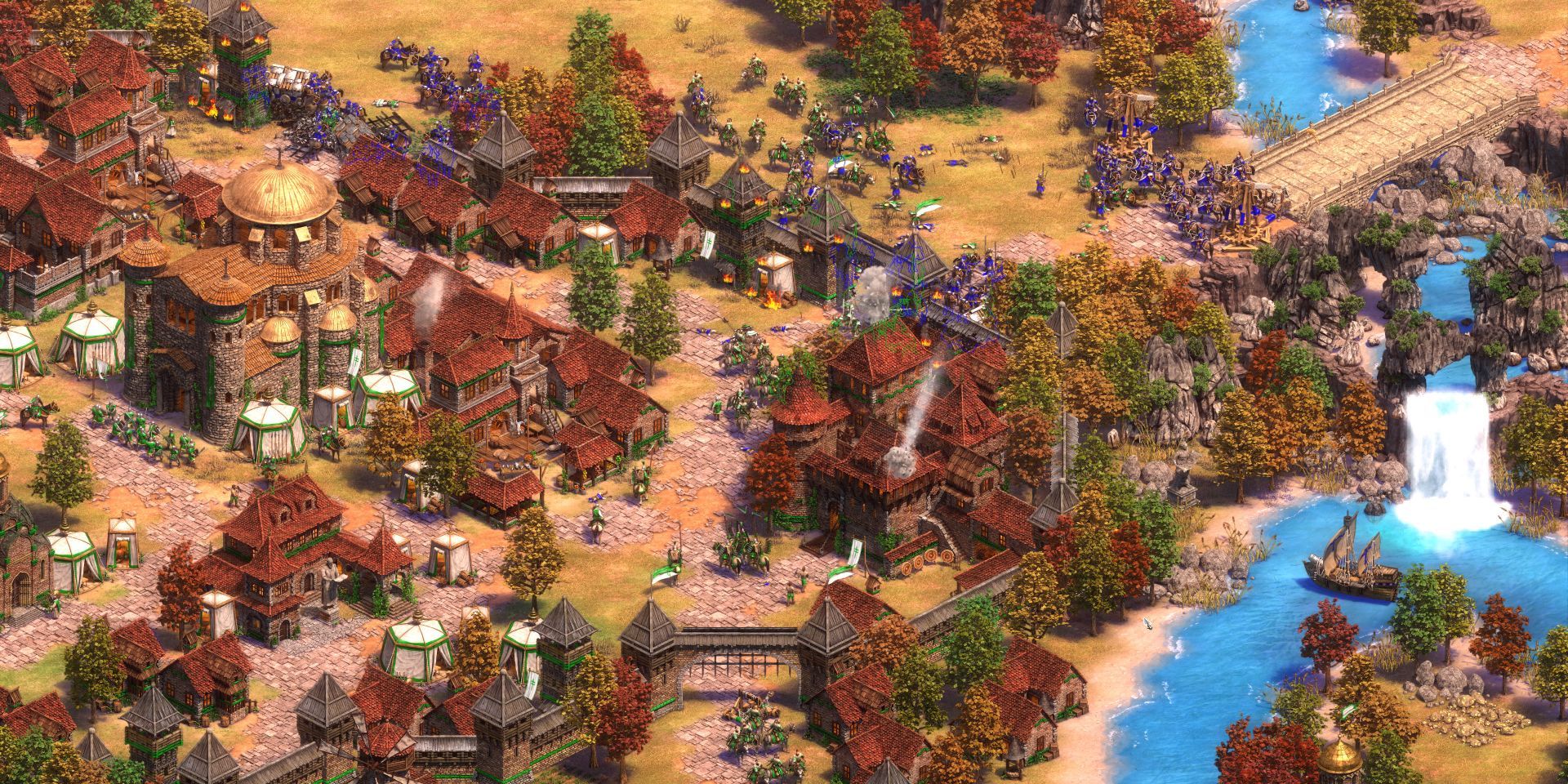 The purple player attacks the green player's vilalge in Age of Empires 2 Definitive Edition