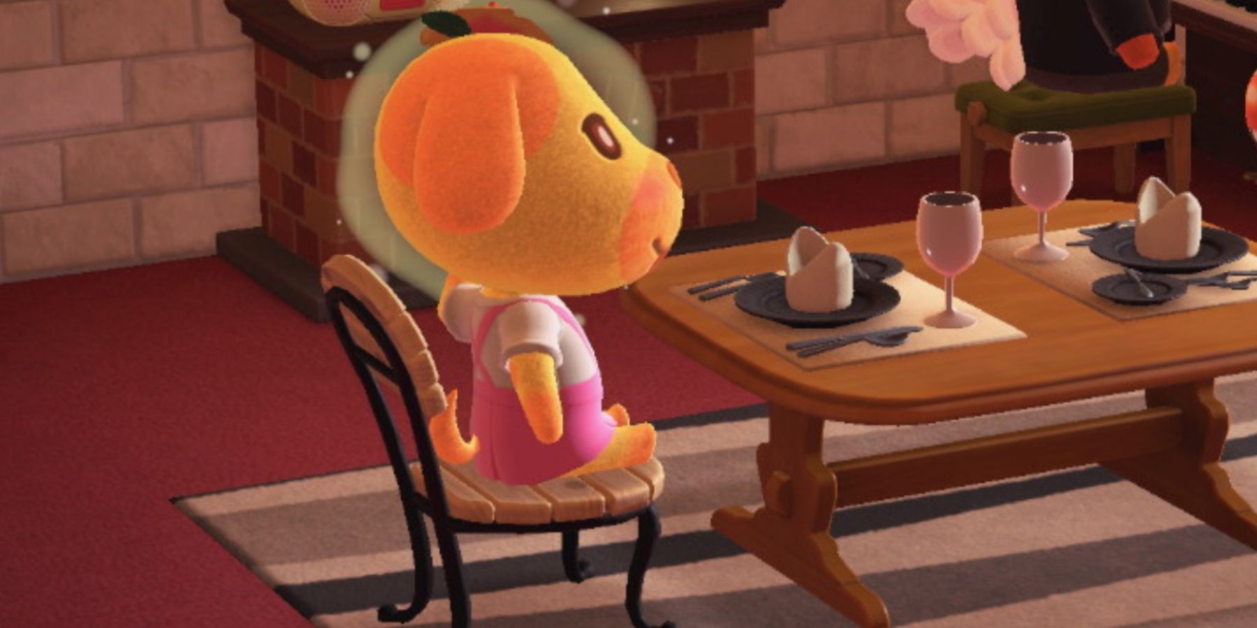 goldie sitting at a dinner table