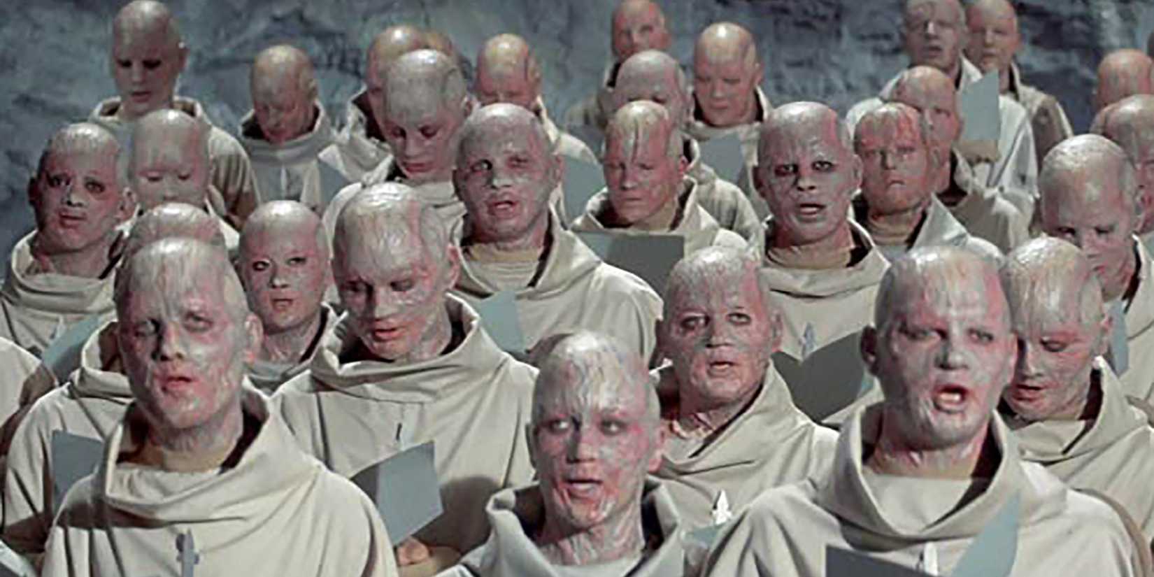 A group of humans wearing white robes in Beneath The Planet Of The Apes