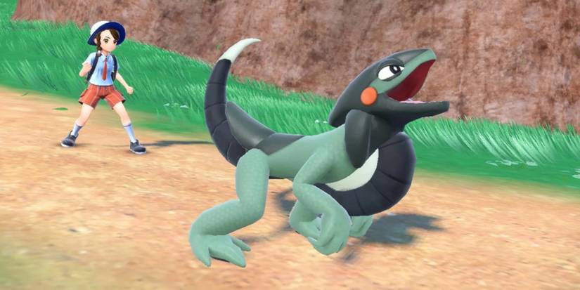 Pokemon Scarlet & Violet Cyclizar and its Trainer on a path