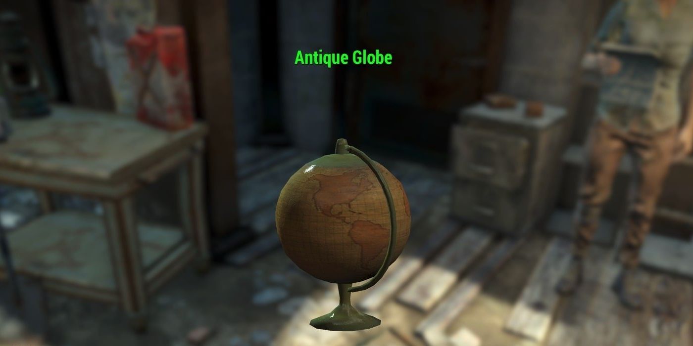 An antique globe with a bright green text overlay saying 