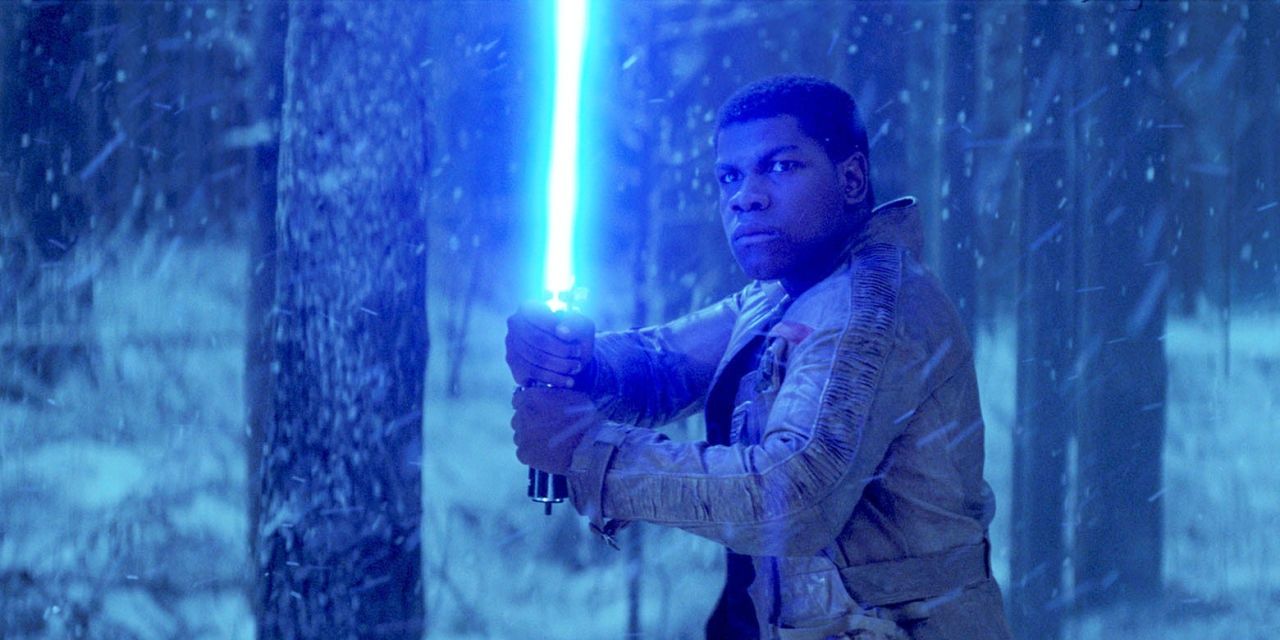 Finn wields a lightsaber in Star Wars: The Force Awakens