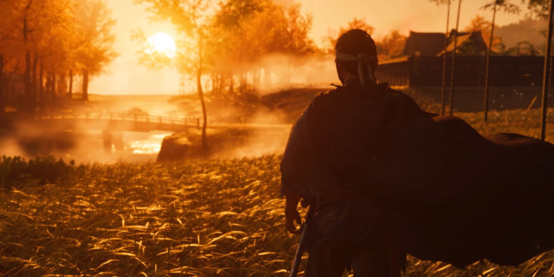 ghost of tsushima's jin sakai looking at sunset