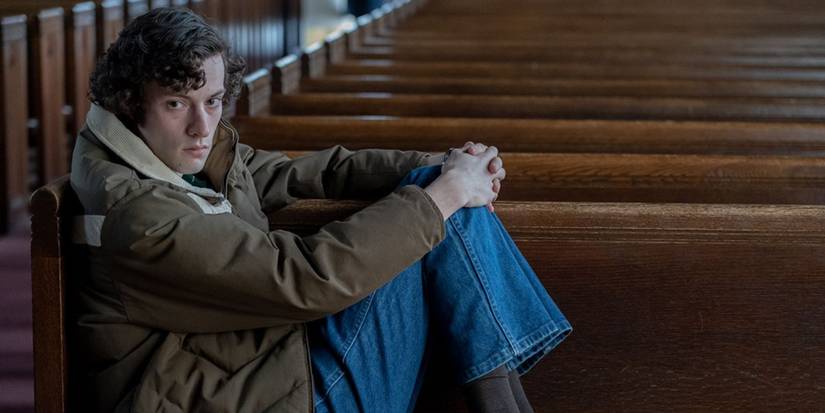 Angus sitting in a church