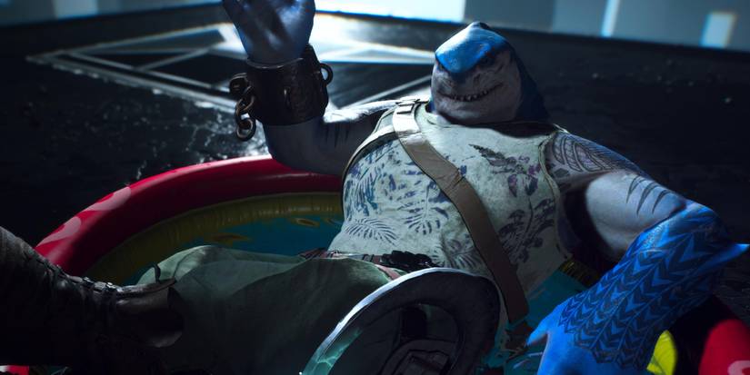 king shark waving in a kiddie pool