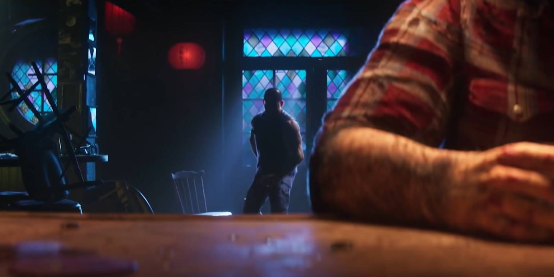 A man obscured by shadows approaching Logan in the trailer for Marvel's Wolverine