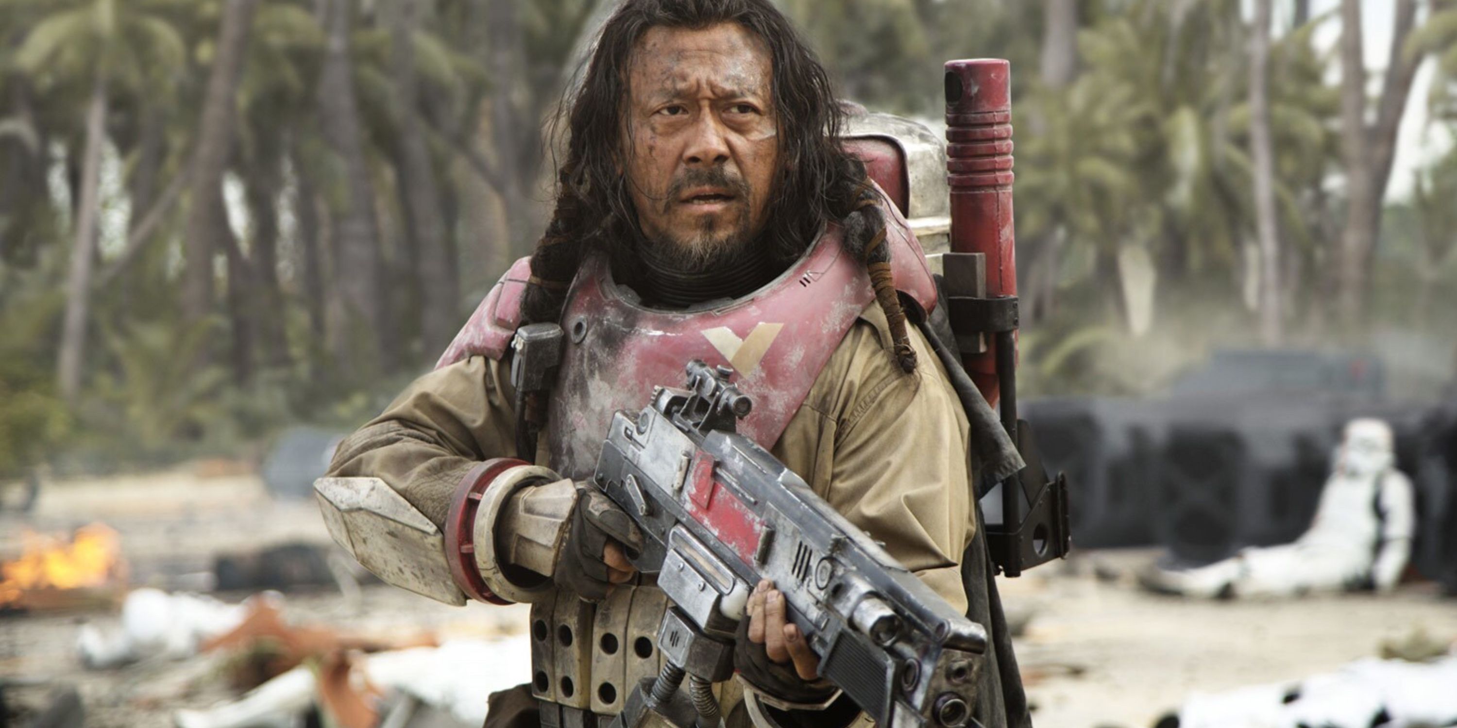 baze malbus holding a blaster from rogue one