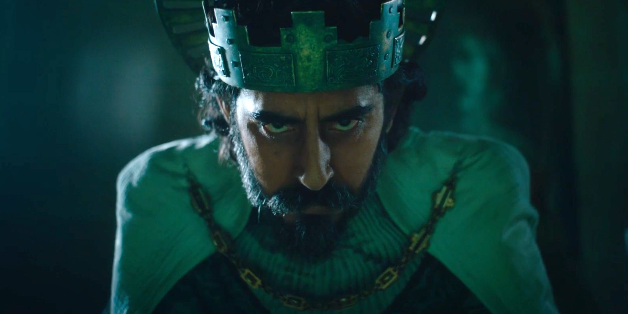 Patel as Gawain wearing a crown