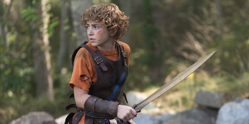 Percy wielding his sword in the woods