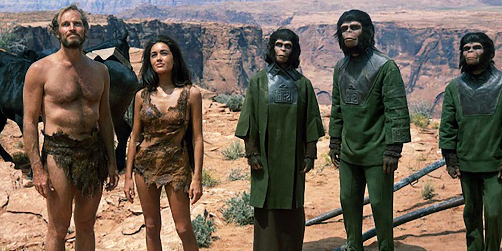 Two humans and three apes in Planet Of The Apes 1968