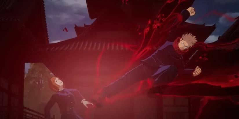 Itadori kicking Nobara with black energy 