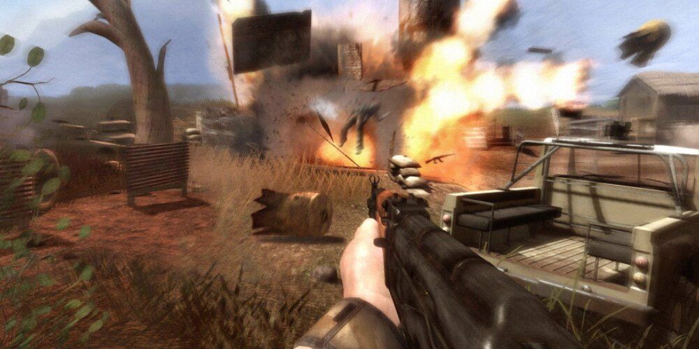 Player firing an AK-47 at an exploding camp of people 