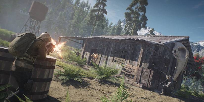 Soldier firing at an enemy in a wooden house 