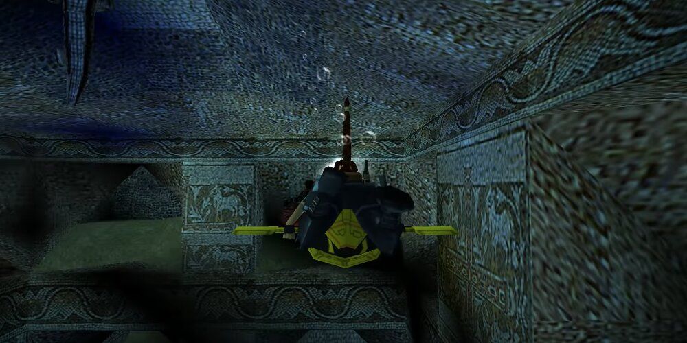 Lara swimming through an underwater maze 