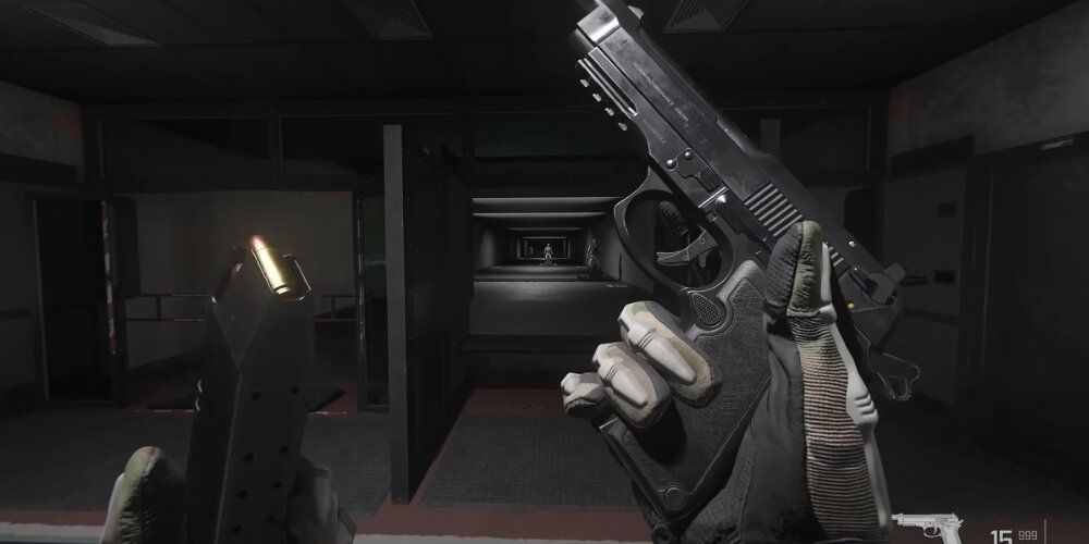 Player reloading a handgun in the firing range 