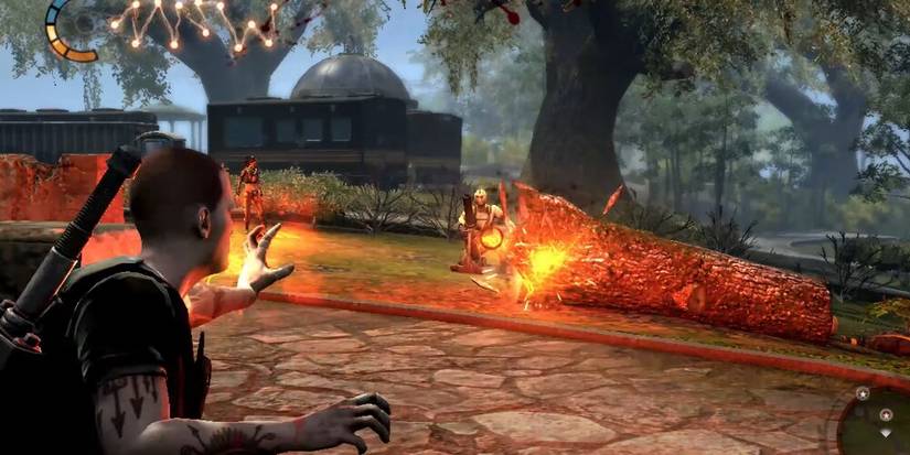 Cole firing a fire blast at enemy soldiers hiding behind a tree 