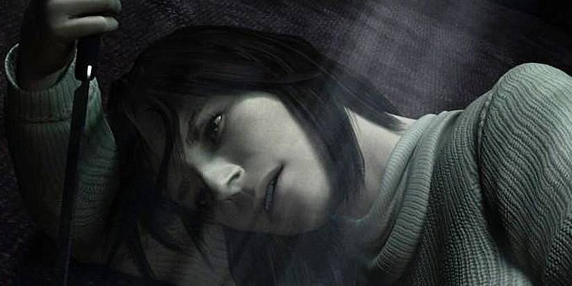 Angela holding a knife against the floor 