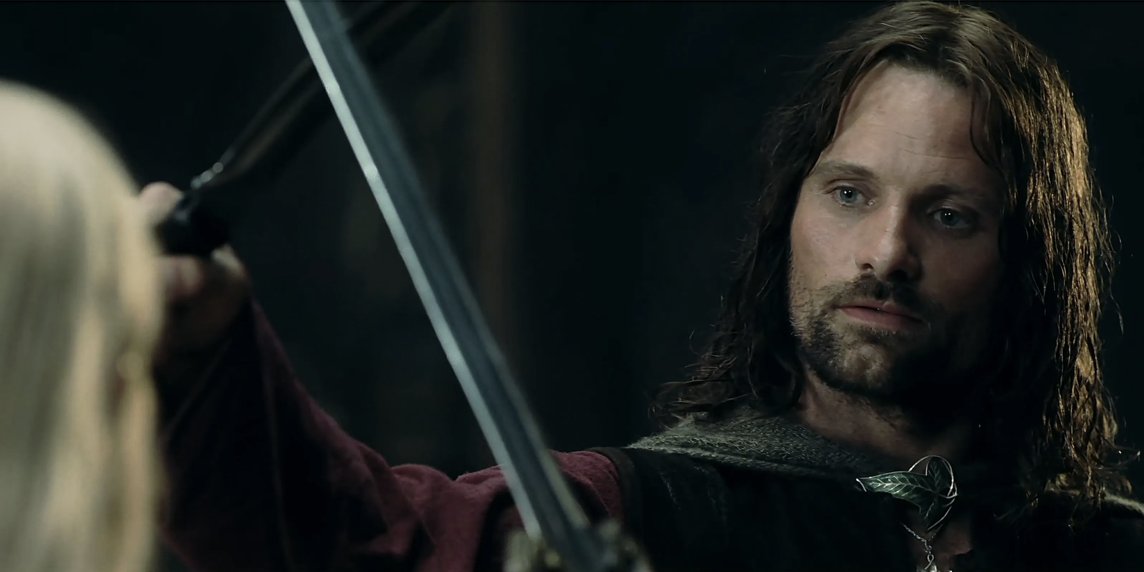 Aragorn clashing swords with Eowyn