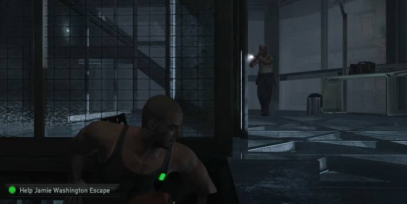 Sam Fisher hiding around a corner from an enemy with a flashlight 
