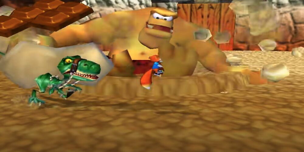 T-Rex and large ogre bosses fighting Conker 
