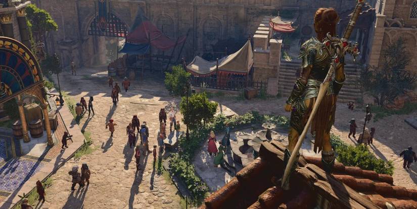 Lae'Zel standing on a roof and looking over a town 