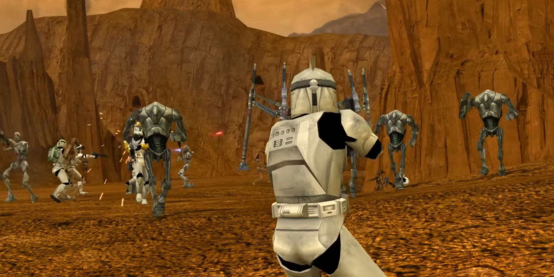 A screenshot of Clone Troopers and Battle Droids fighting on Geonosis in Star Wars Battlefront Classic Collection.