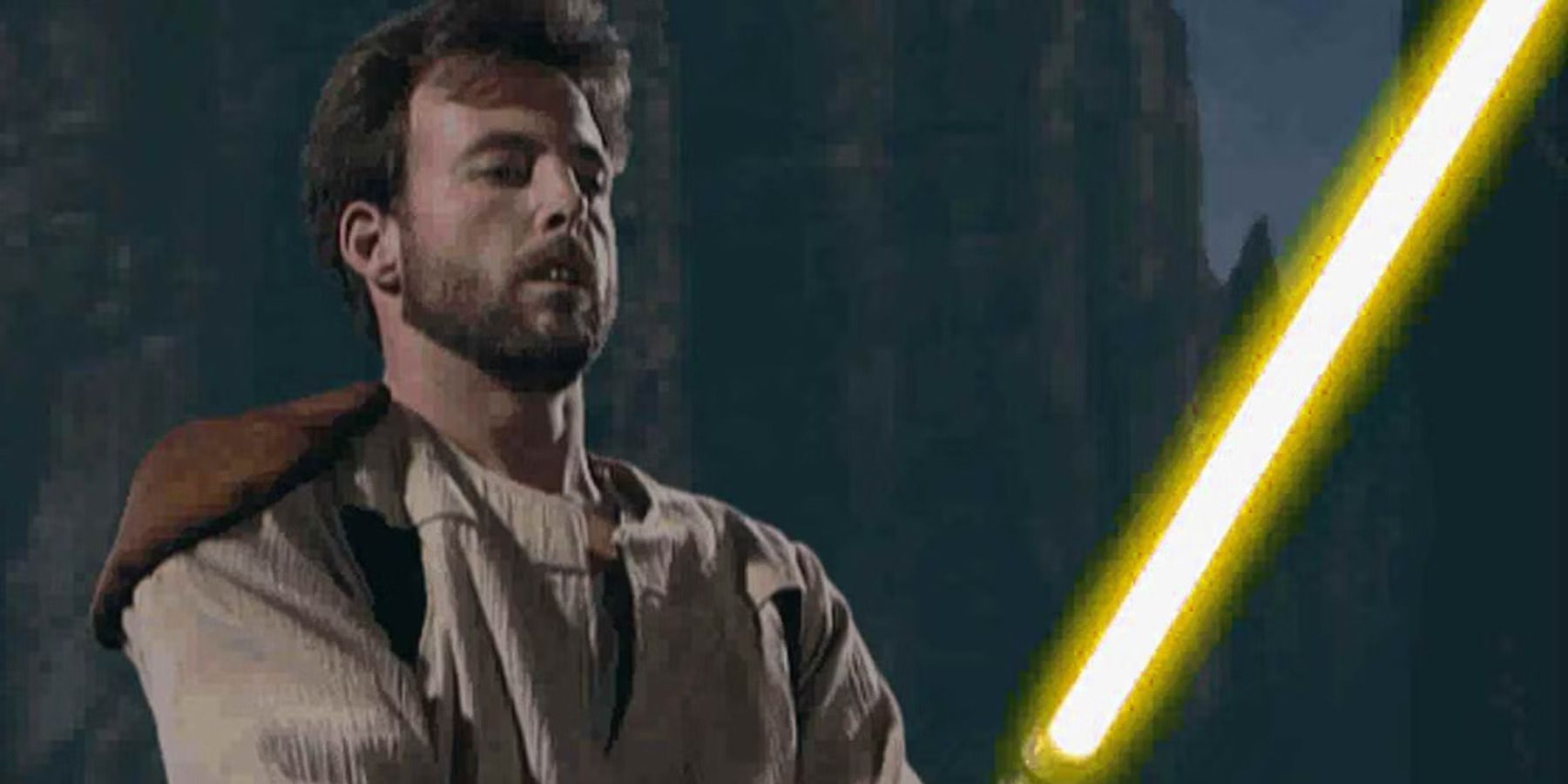 Kyle Katarn holds a yellow lightsaber