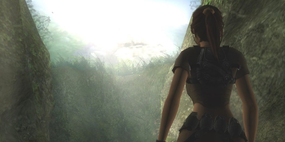 lara standing in front of a jungle