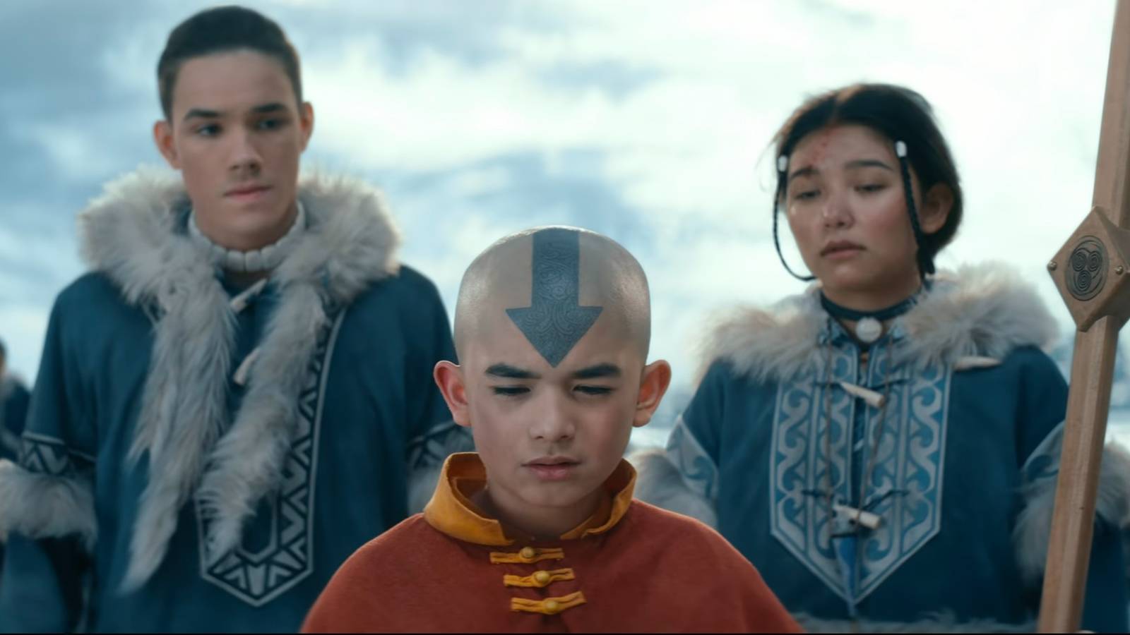 Sokka, Aang, and Katara standing in a line
