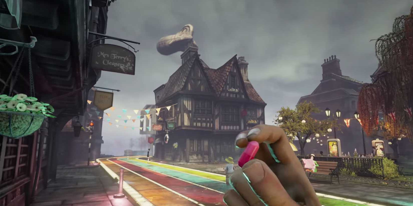 Arthur holding a red Joy pill in between his fingers on a rainbow-colored street
