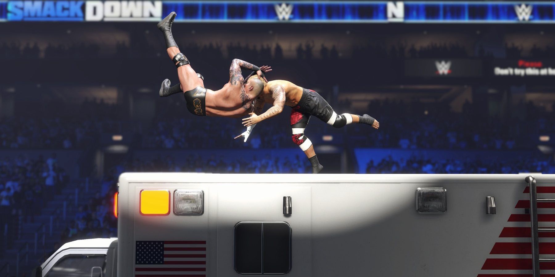 A screenshot of Randy Orton giving Solo Sikoa an RKO atop an Ambulence in WWE 2K24.